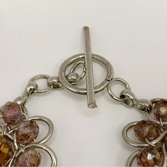 Silver tone open work and iridescent purple glass bead flower link bracelet - Picture 5 of 10